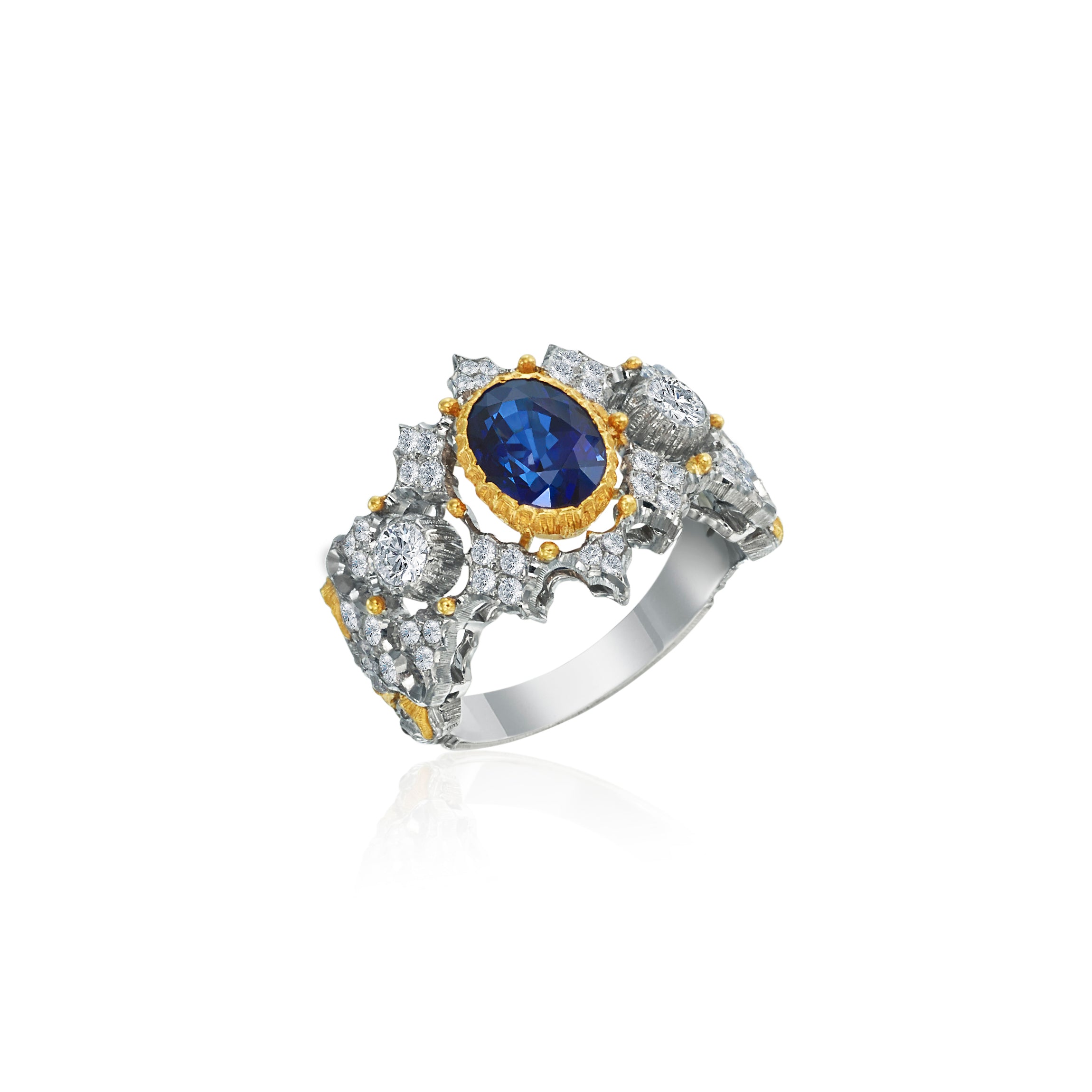 A Buccellati ring in 18K gold and white gold set with a faceted sapphire  and round brilliant-cut diamonds. - Bukowskis